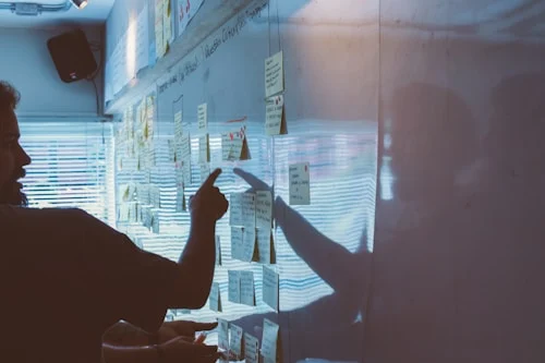 Executives building a strategic vision together on a whiteboard during a planning session