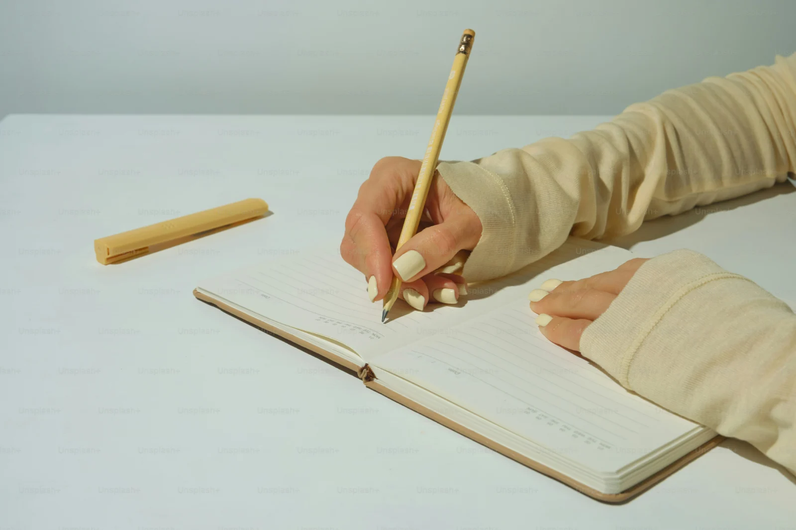 Midlife woman using a notebook to plan a second chapter life change