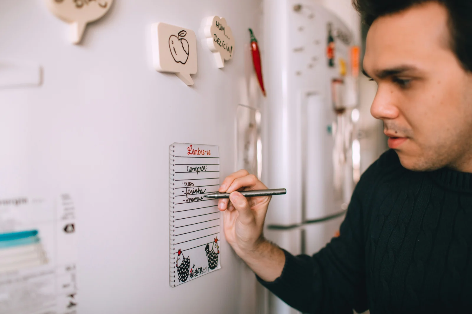 Focused person using a short task list and two-minute rule examples to overcome procrastination