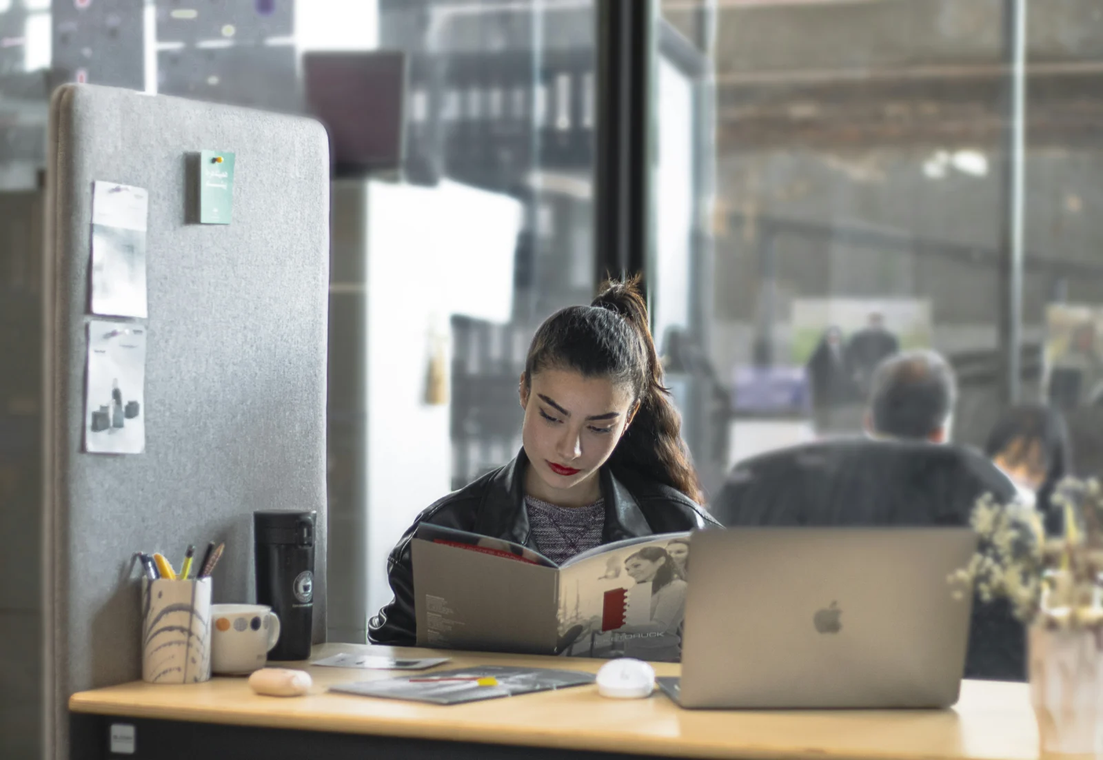 Woman at a desk using a simple first step to stop procrastinating and begin focused work