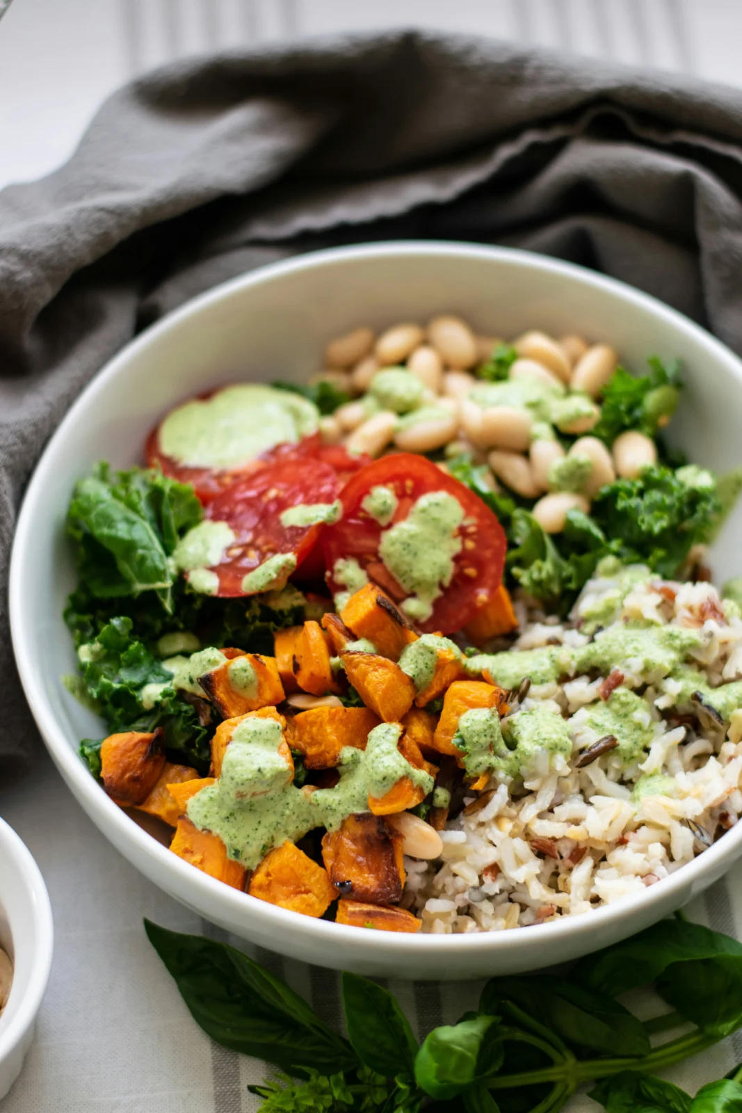 Plant-based diet meal prep with grains, vegetables, beans, and fresh ingredients