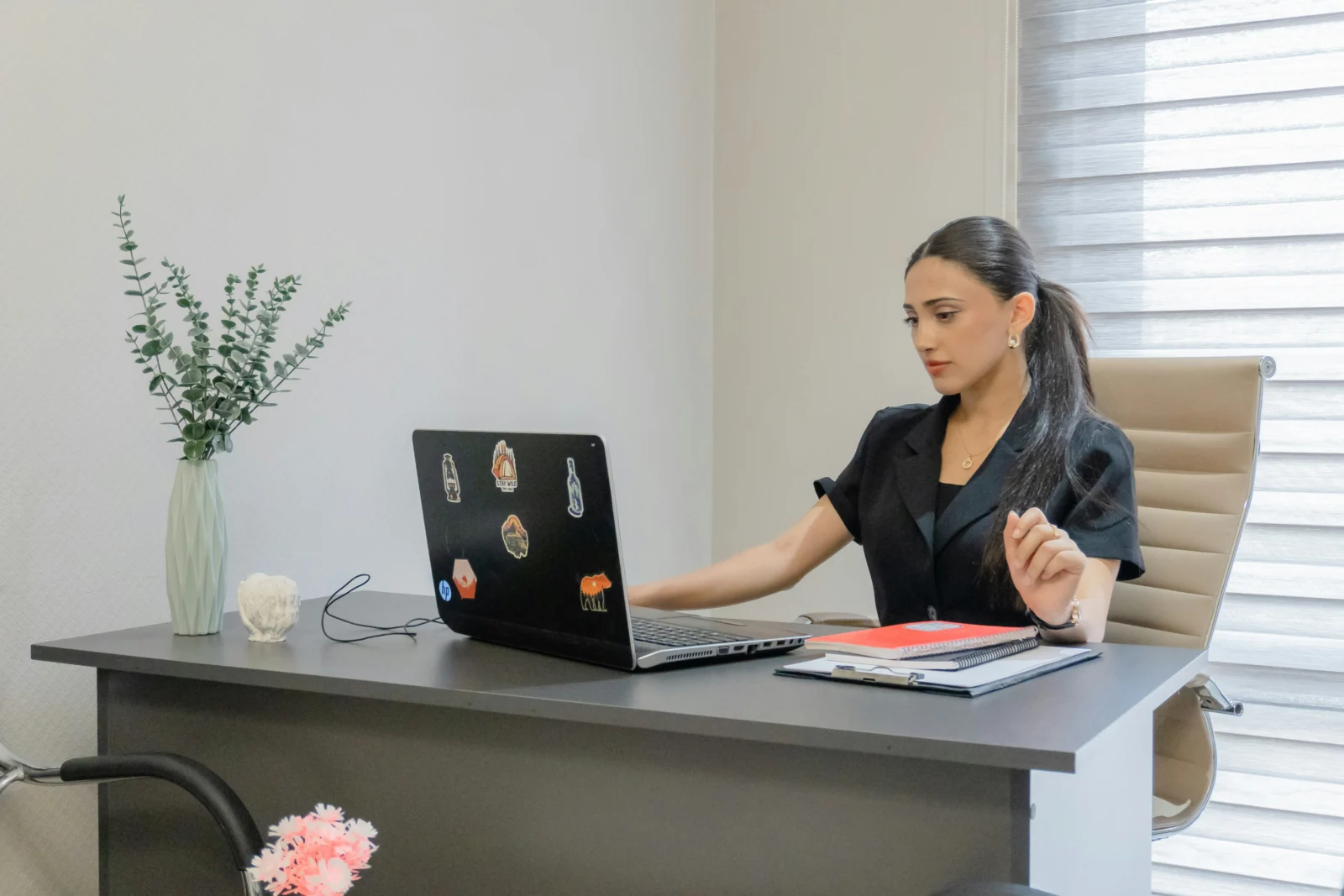 Professional reviewing goal achievement strategies and weekly priorities at a desk