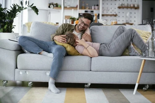 Couple sitting together having a calm, open conversation — learning to communicate needs in a relationship