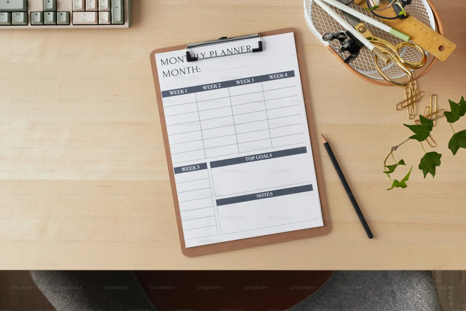 Professional completing a weekly review to track successful goal methods and progress