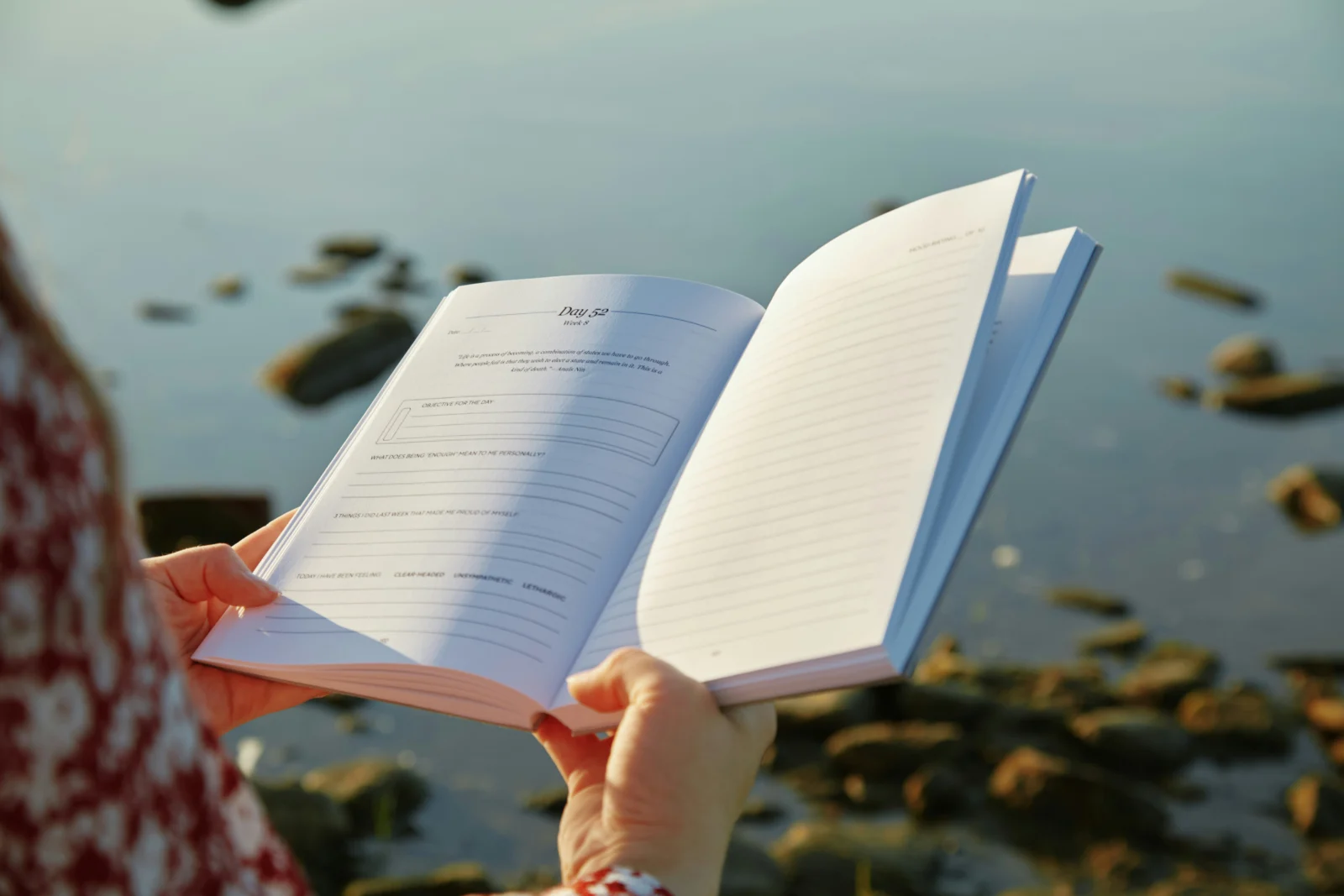 Person journaling during a self-worth reflection practice at home