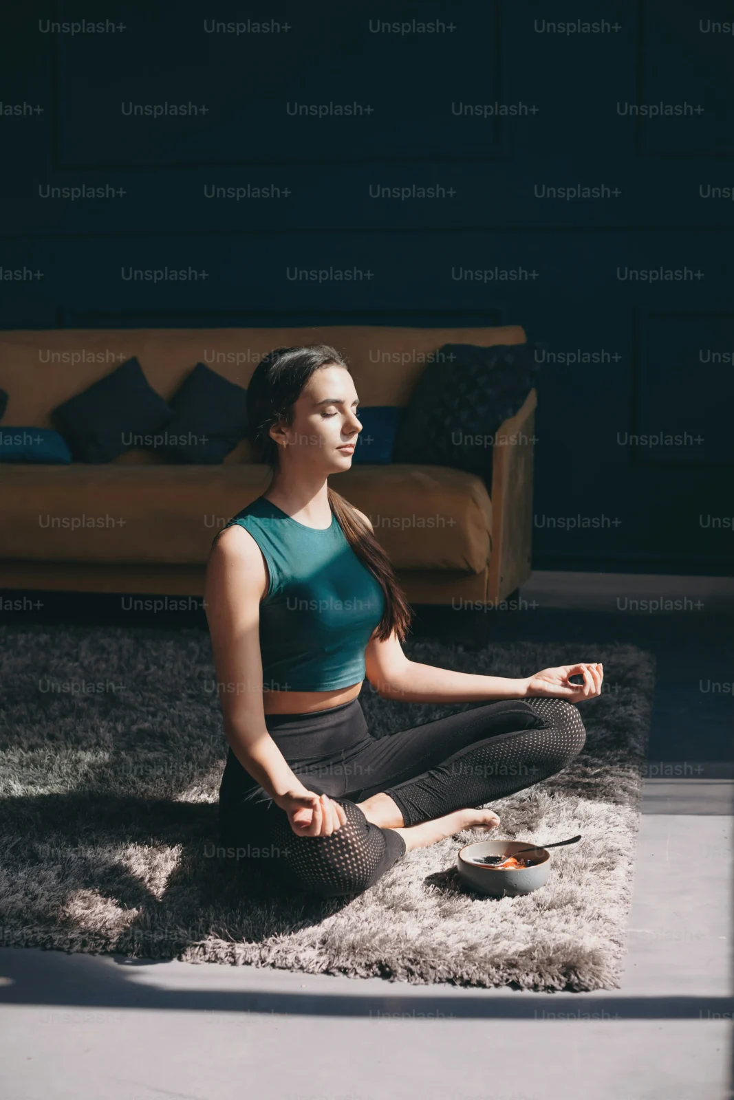 Person lying comfortably at home practicing body scan meditation for relaxation