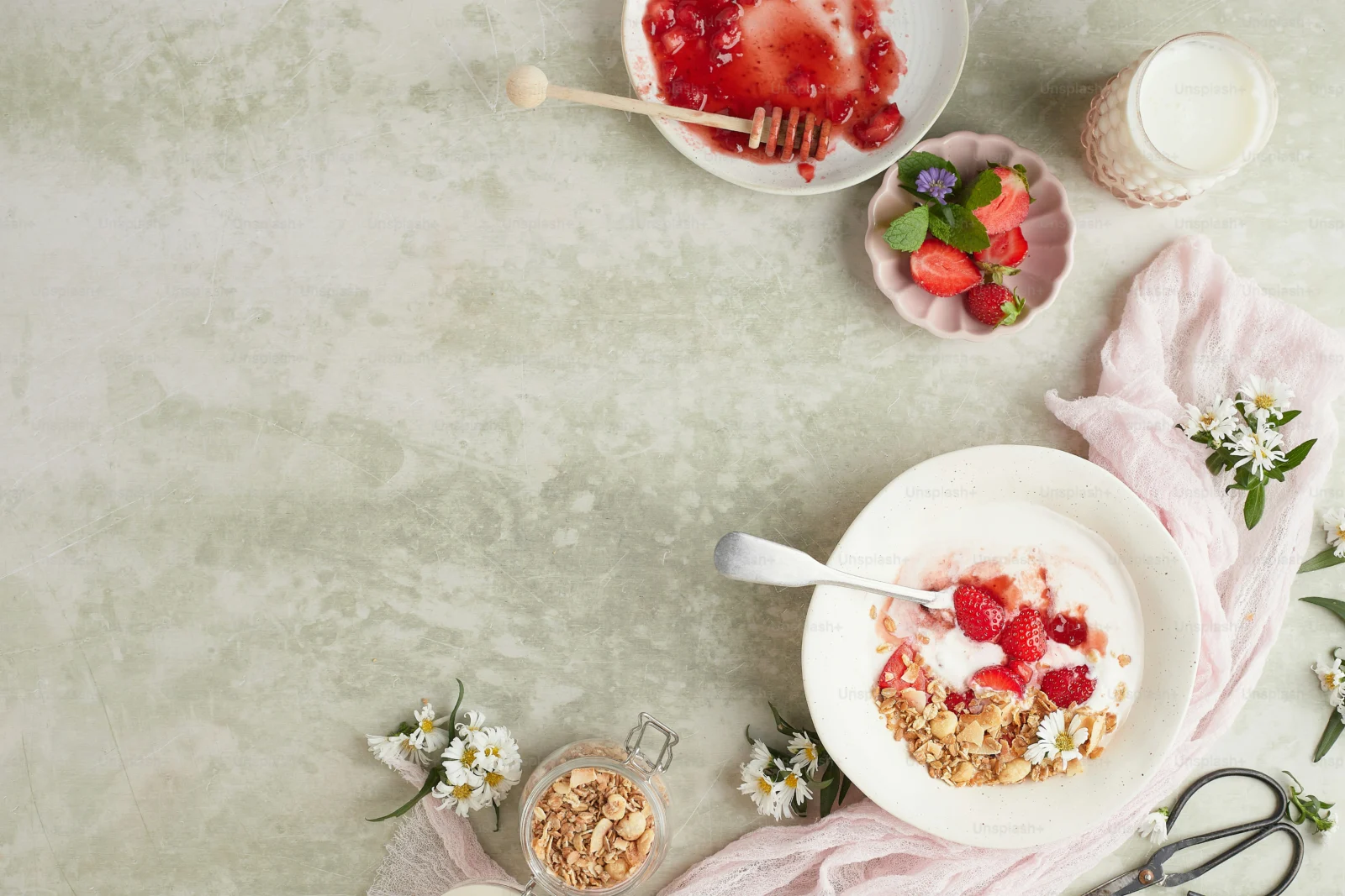 Whole grains, vegetables, fruit, and yogurt arranged for a microbiome health focused meal