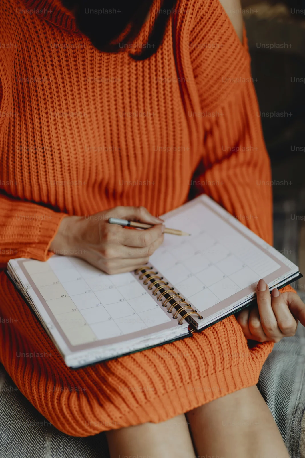 Person using weekly planning to focus on fewer goals and reduce goal overload