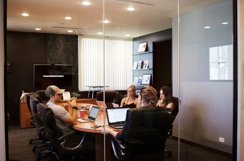 Senior leader discussing executive coaching goals in a professional meeting