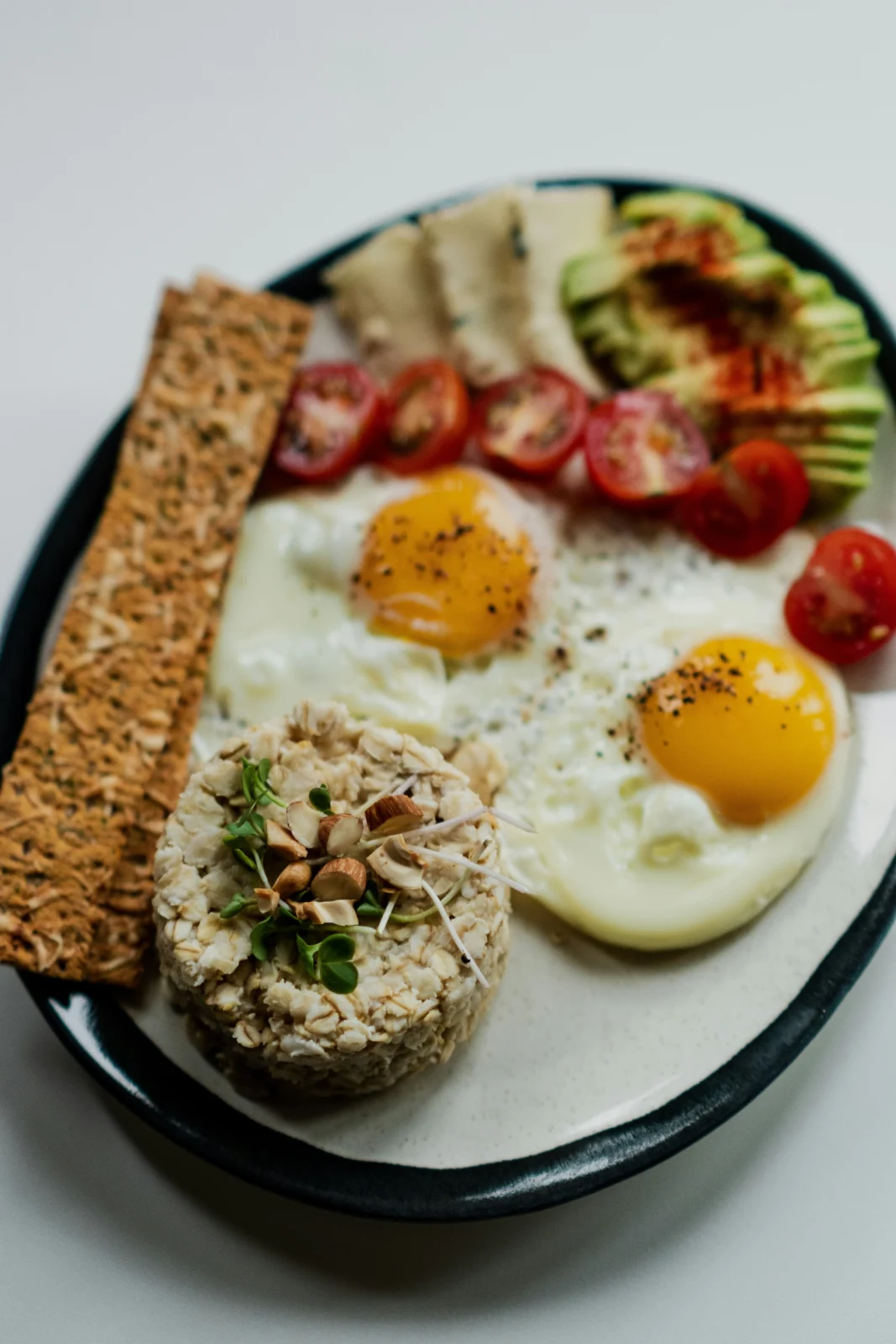 Oats, nuts, yogurt and eggs representing affordable everyday superfoods