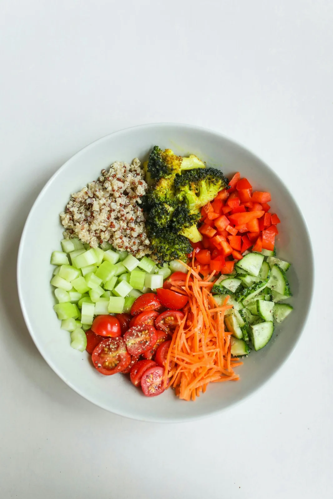 Weekly meal prep with colorful grain bowls and fresh vegetables ready for weekday lunches