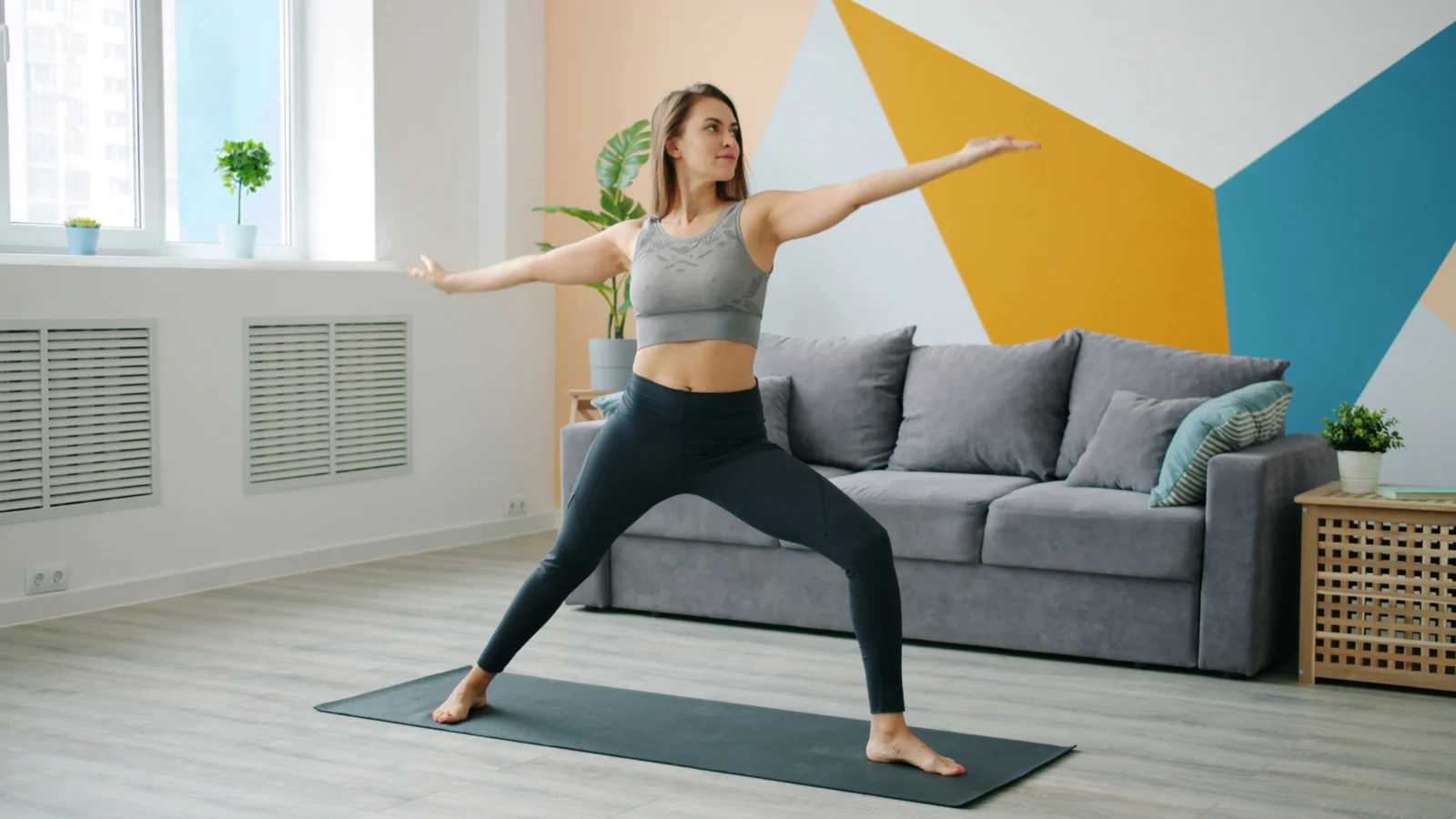 Woman practicing gentle somatic movement therapy with mindful body awareness at home