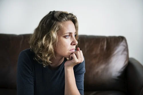 Woman showing signs of high emotional intelligence by listening attentively during a meaningful conversation