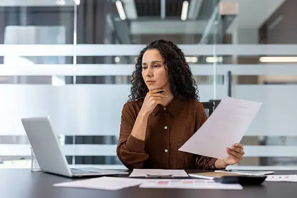 Executive presence shown by a confident leader speaking clearly in a meeting